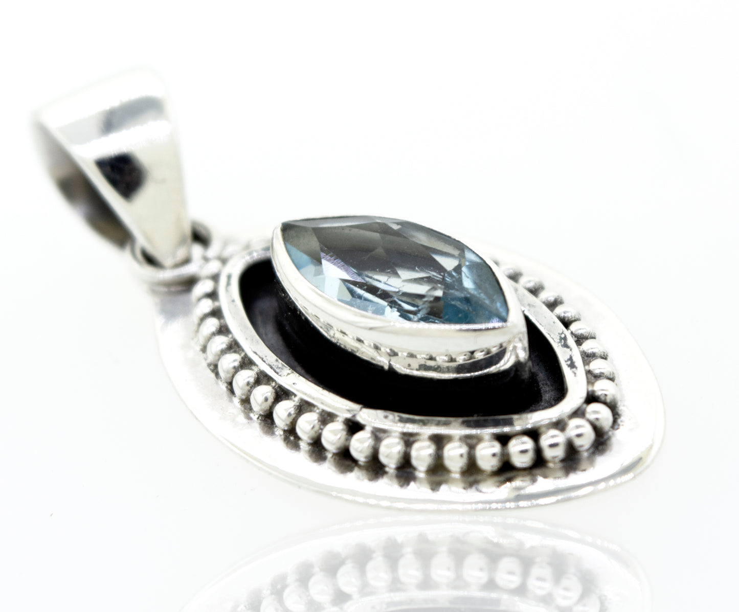 
                  
                    A Beautiful Marquise Shaped Blue Topaz Pendant With Beads Design featuring a marquise-shaped blue topaz stone by Super Silver.
                  
                