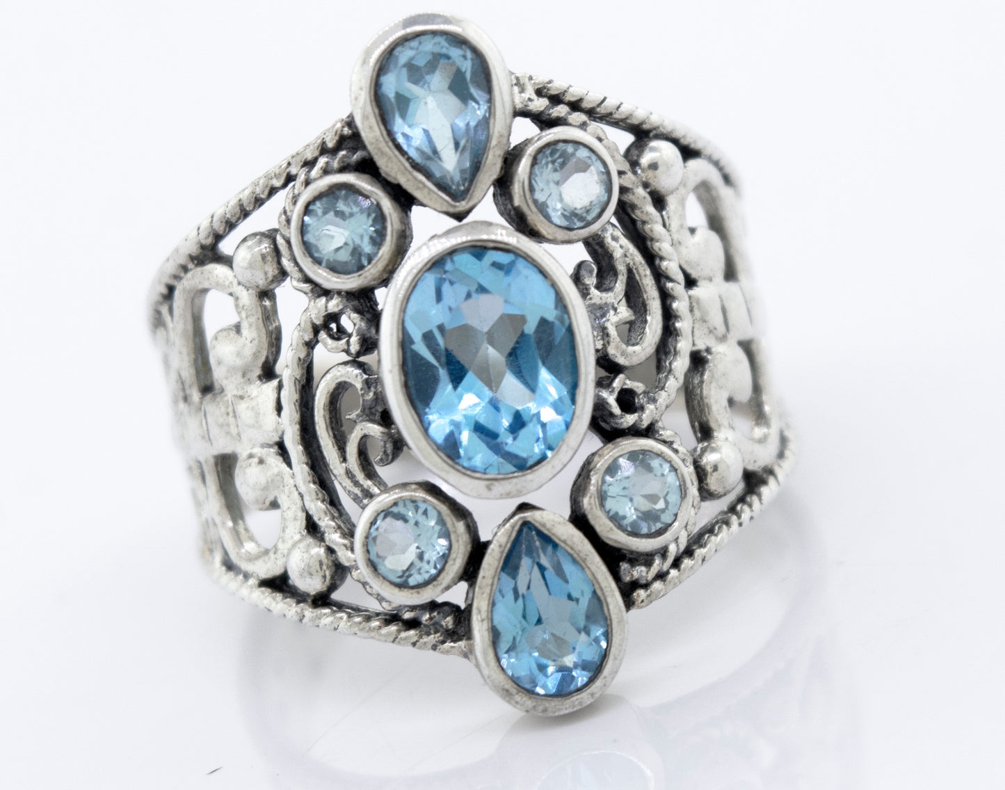 A Blue Topaz Ring With Freestyle Design adorned with mesmerizing blue topaz stones from Super Silver.