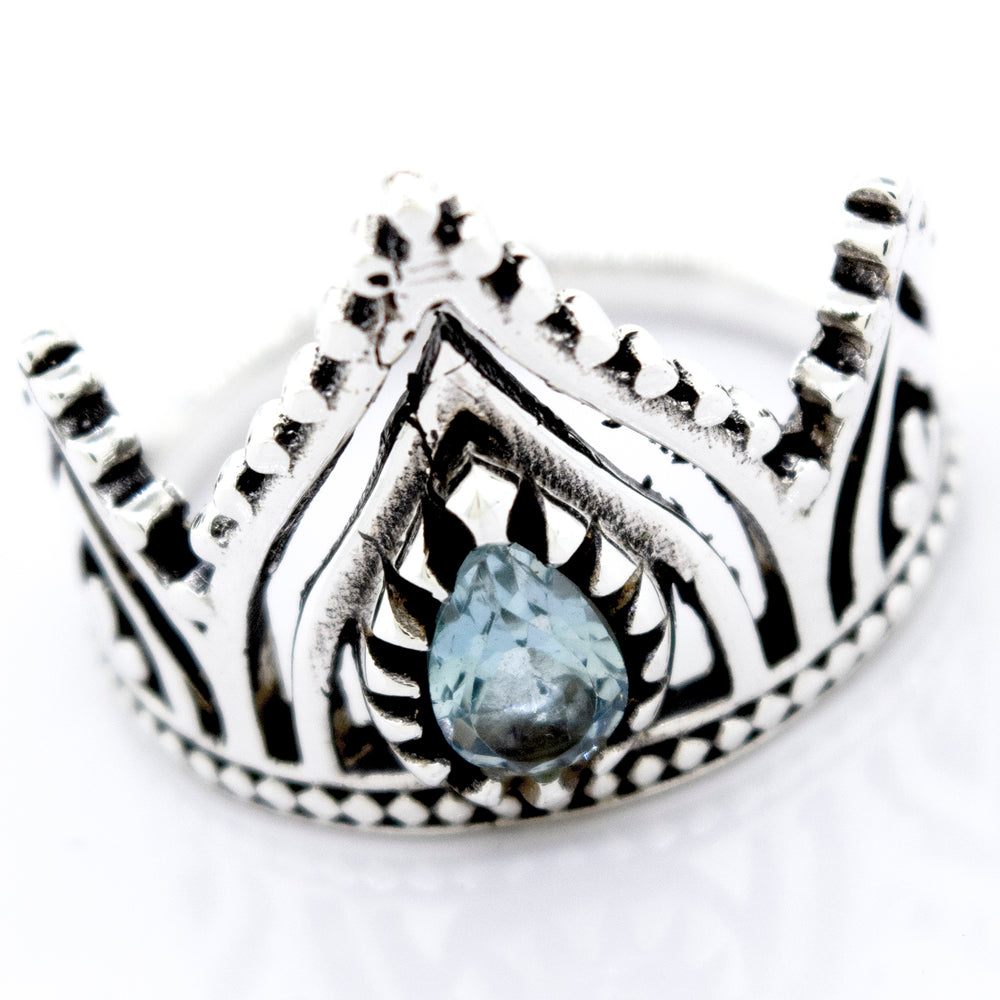 A Super Silver Sterling Silver Crown Ring with a Teardrop Shape Blue Topaz stone.