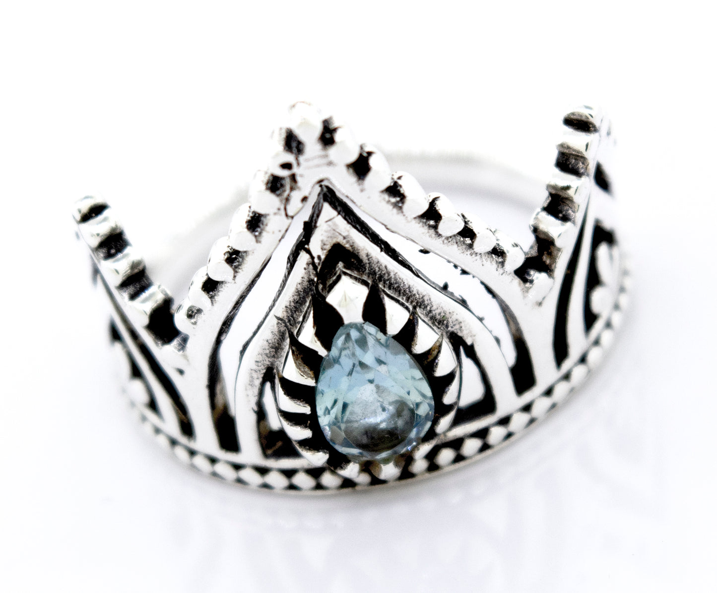 A Super Silver Sterling Silver Crown Ring with a Teardrop Shape Blue Topaz stone.