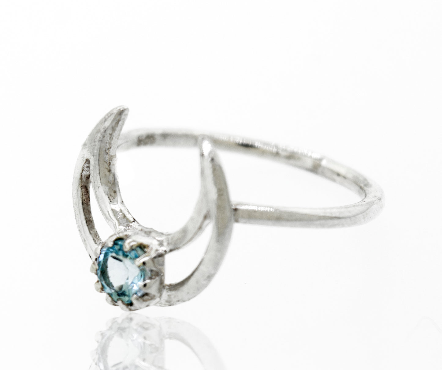 
                  
                    A Super Silver designer silver ring with a vibrant blue topaz stone set in an Online Only Exclusive Moon Design.
                  
                