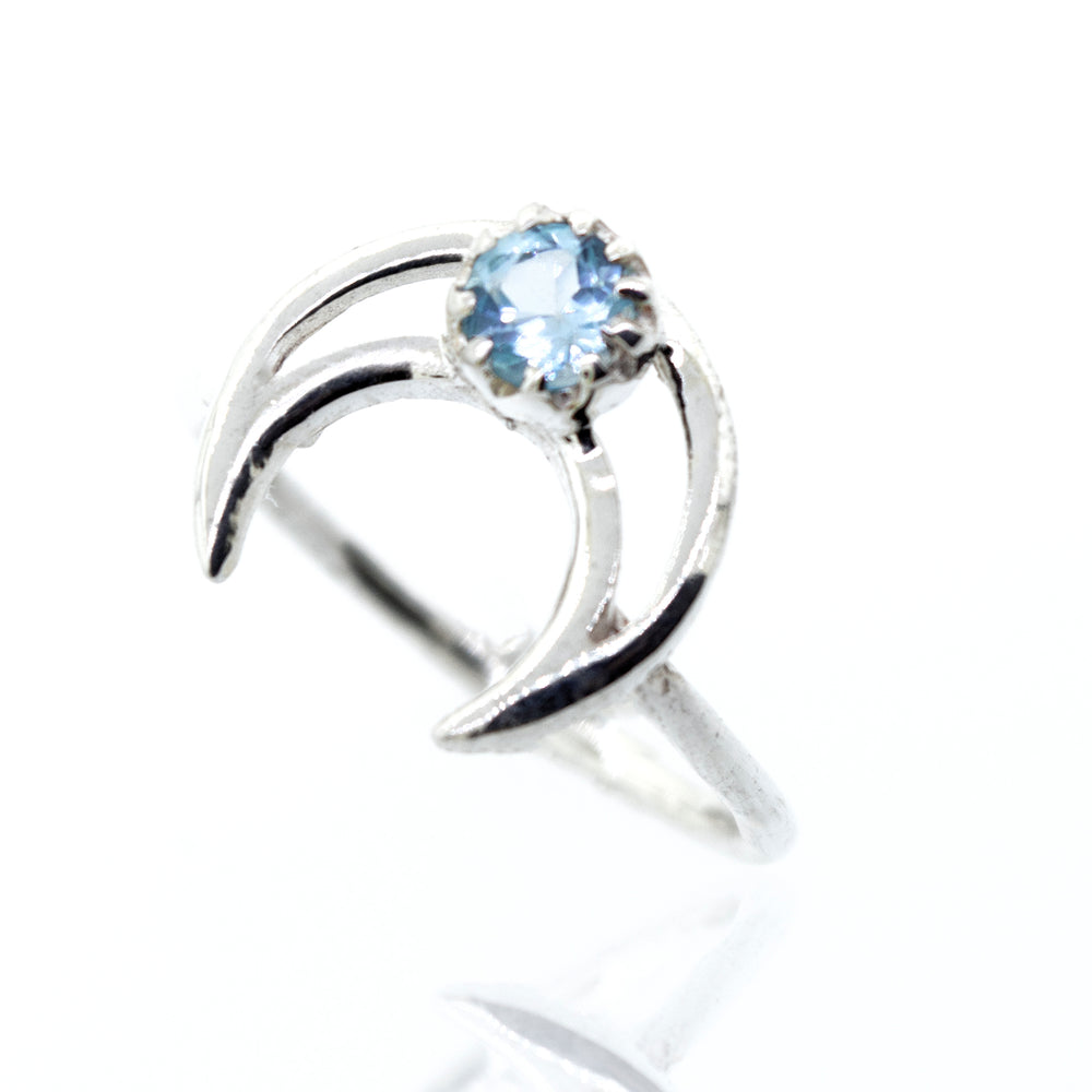 
                  
                    A Super Silver designer Online Only Exclusive Moon Design Blue Topaz Ring.
                  
                