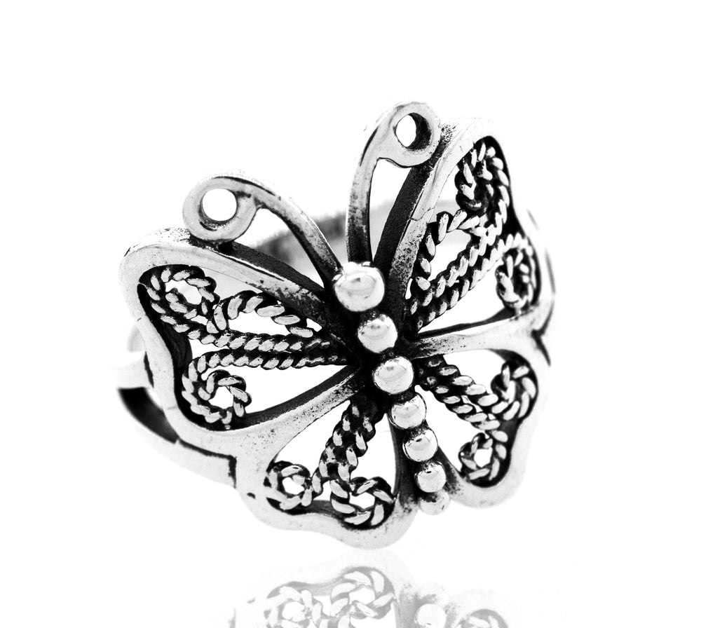 A minimalist Filigree Butterfly Ring with ornate details.