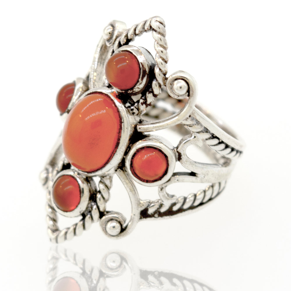 
                  
                    A Super Silver sterling silver ring adorned with a vibrant red coral stone, available at our trusted online store.
                  
                