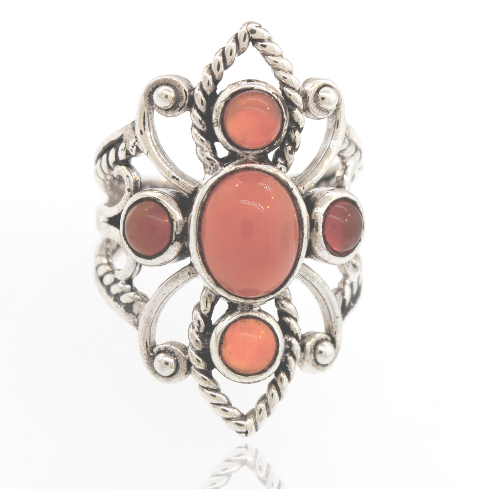 
                  
                    A Super Silver sterling silver ring with a coral stone in the center, available in our online store.
                  
                
