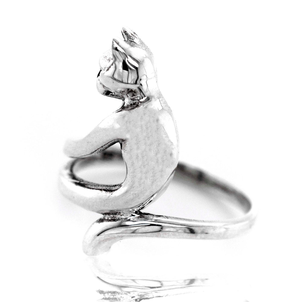 A minimalist Cat Ring with a cat sitting on it.