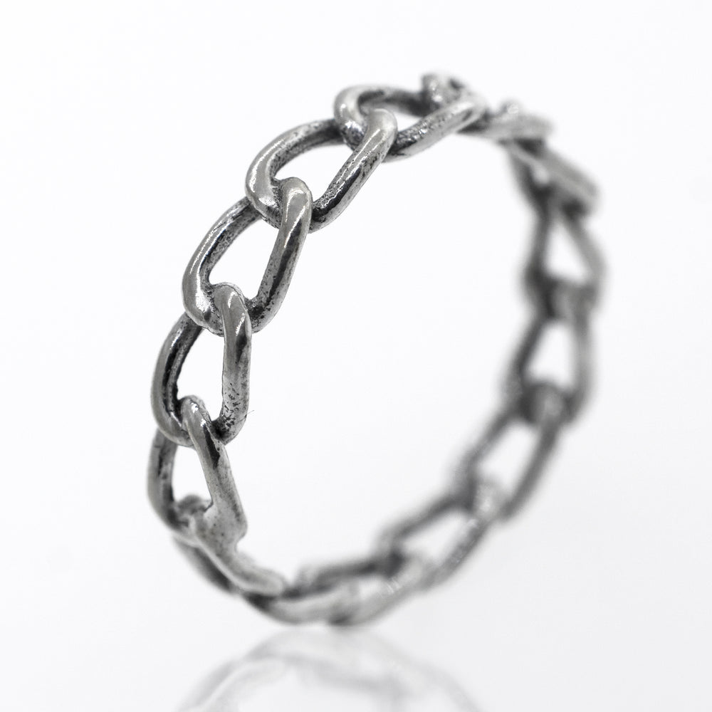 
                  
                    A Super Silver Chain Link Wire Ring on a white surface.
                  
                