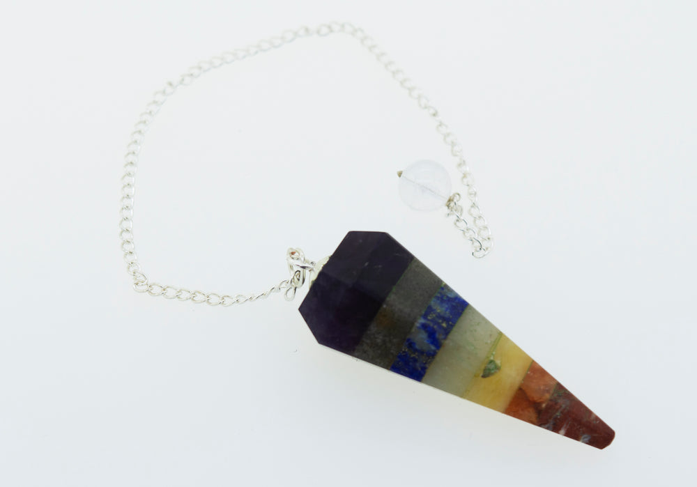 A colorful necklace with a Chakra Stones Pendulum, perfect for those interested in witchcraft.