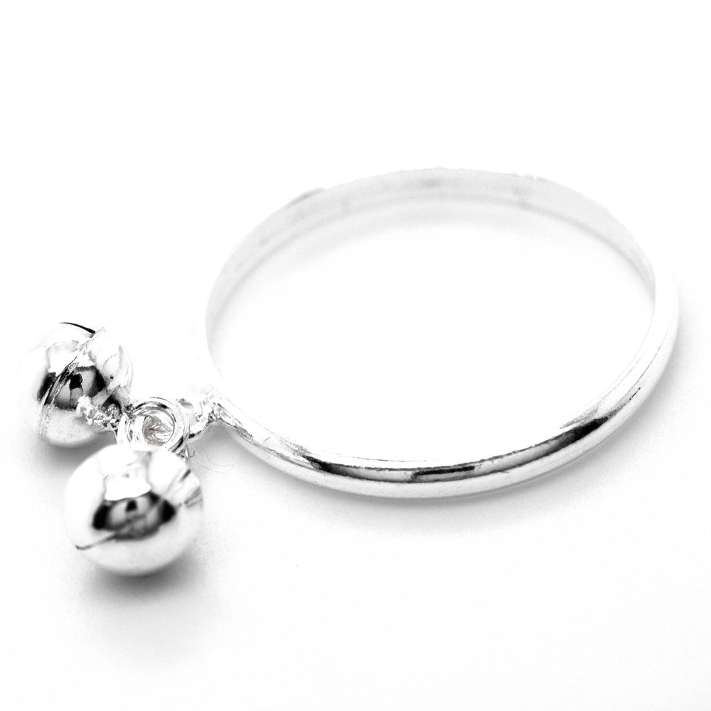
                  
                    A Delicate Charm Ring with Bells adorned with silver balls and branded by Super Silver.
                  
                