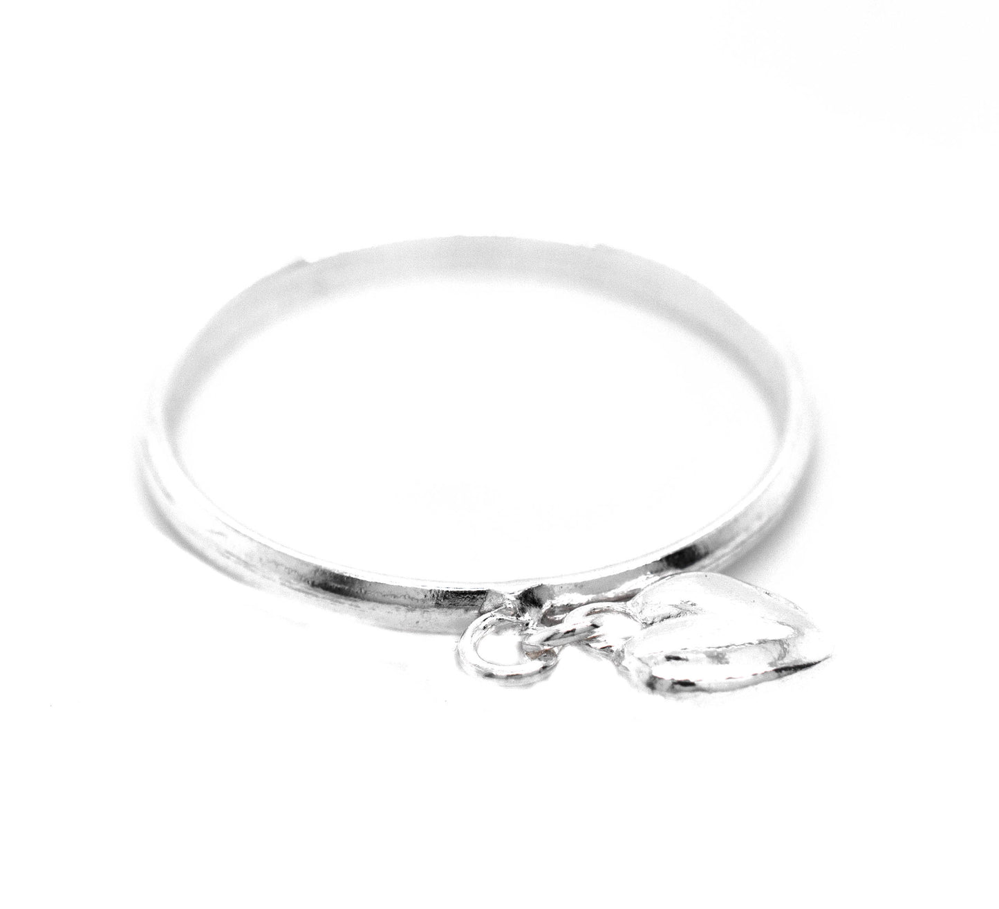 
                  
                    A Delicate Heart Charm Ring bangle with a heart charm, by Super Silver.
                  
                