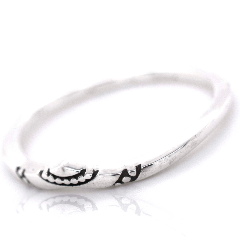 
                  
                    A minimalist Dainty Chevron Band With Etched Design.
                  
                