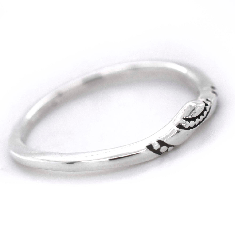 
                  
                    A stackable Dainty Chevron Band With Etched Design made of sterling silver.
                  
                