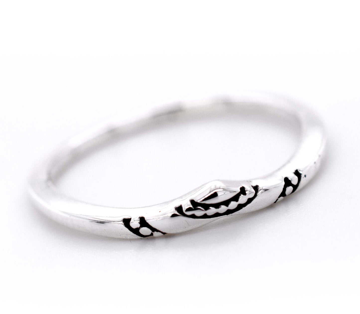 A minimalist silver Dainty Chevron Band With Etched Design, perfect for stacking.
