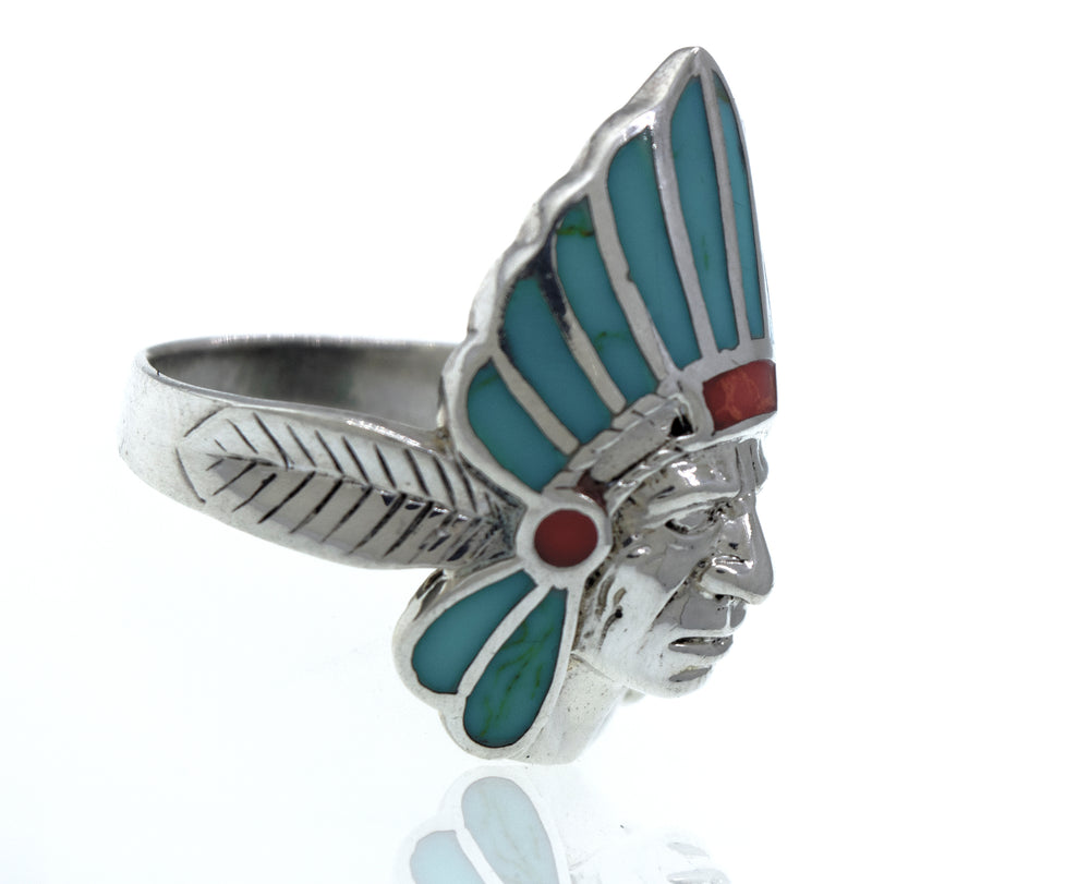 A Super Silver Turquoise And Coral Chief Head Ring, making it a statement piece for men.