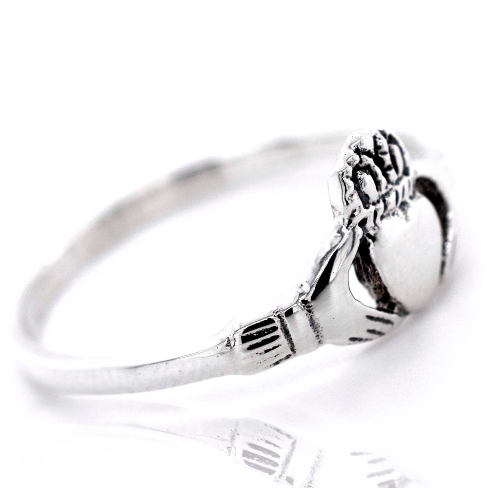 A Celtic Claddagh Ring in sterling silver.
