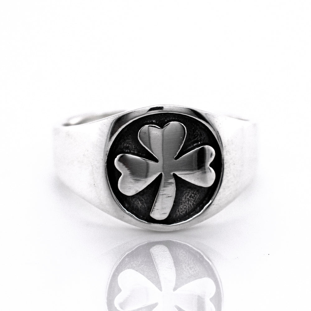 
                  
                    An oxidized Super Silver Three Leaf Clover Band with a sterling silver band on a white background.
                  
                
