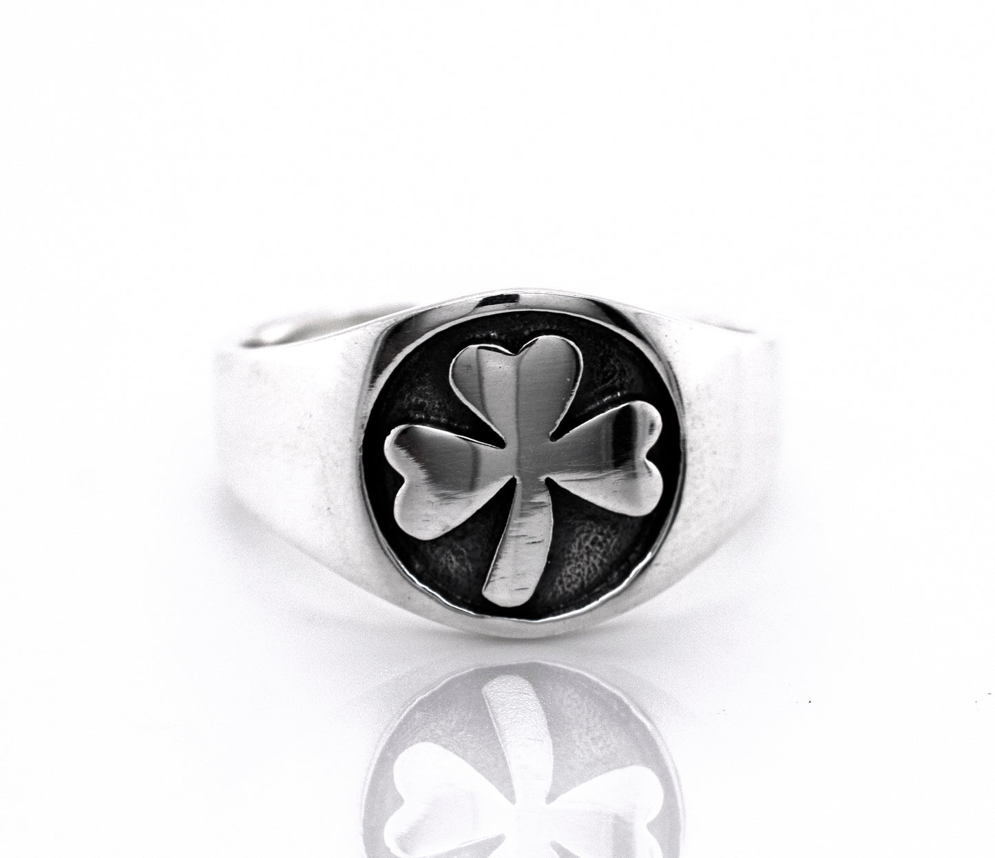 
                  
                    An oxidized Super Silver Three Leaf Clover Band with a sterling silver band on a white background.
                  
                