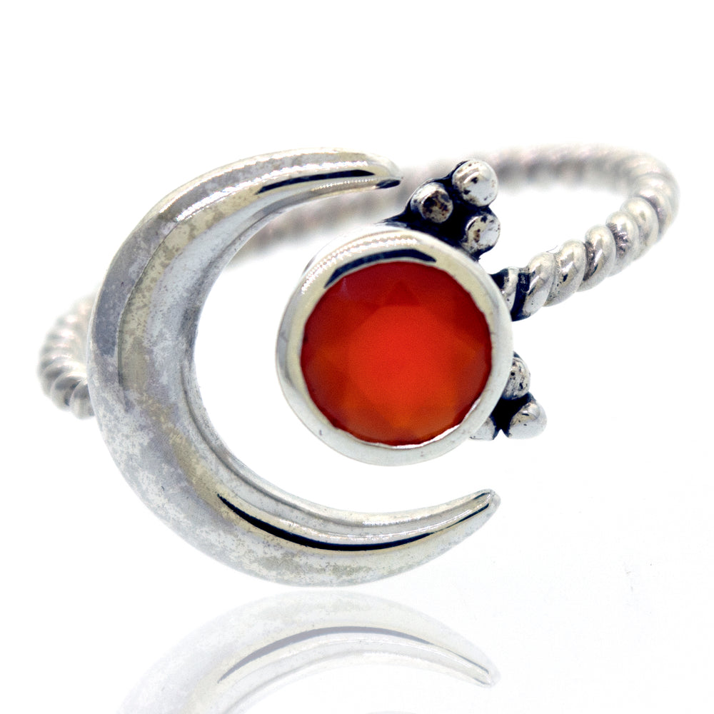 Online Only Exclusive Adjustable Carnelian Moon Ring with a carnelian crystal, accompanied by small sterling silver beads on a twisted band, isolated on a white background.