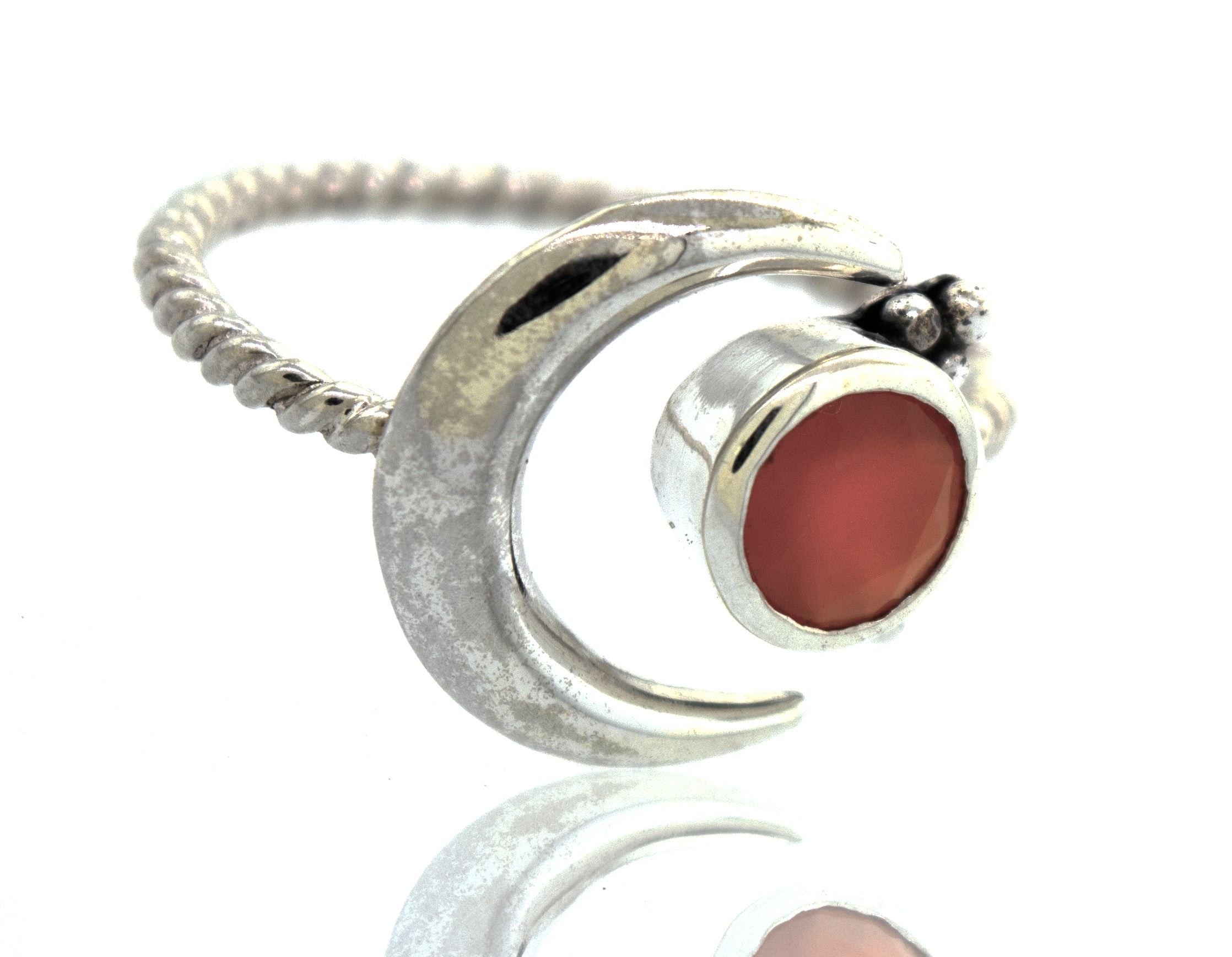 Online Only Exclusive Adjustable Carnelian Moon Ring displayed on a reflective surface.
