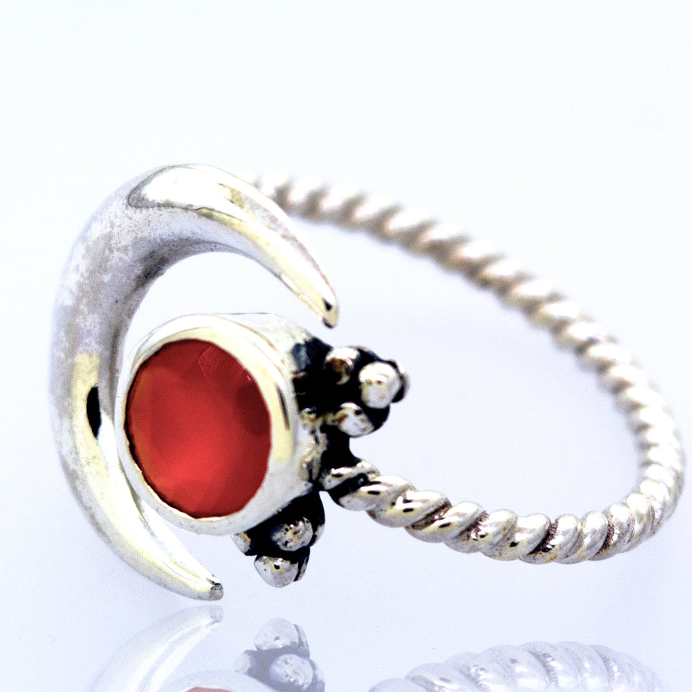 
                  
                    An Online Only Exclusive Adjustable Carnelian Ring with a stunning red carnelian crystal in the middle, from the brand Super Silver.
                  
                