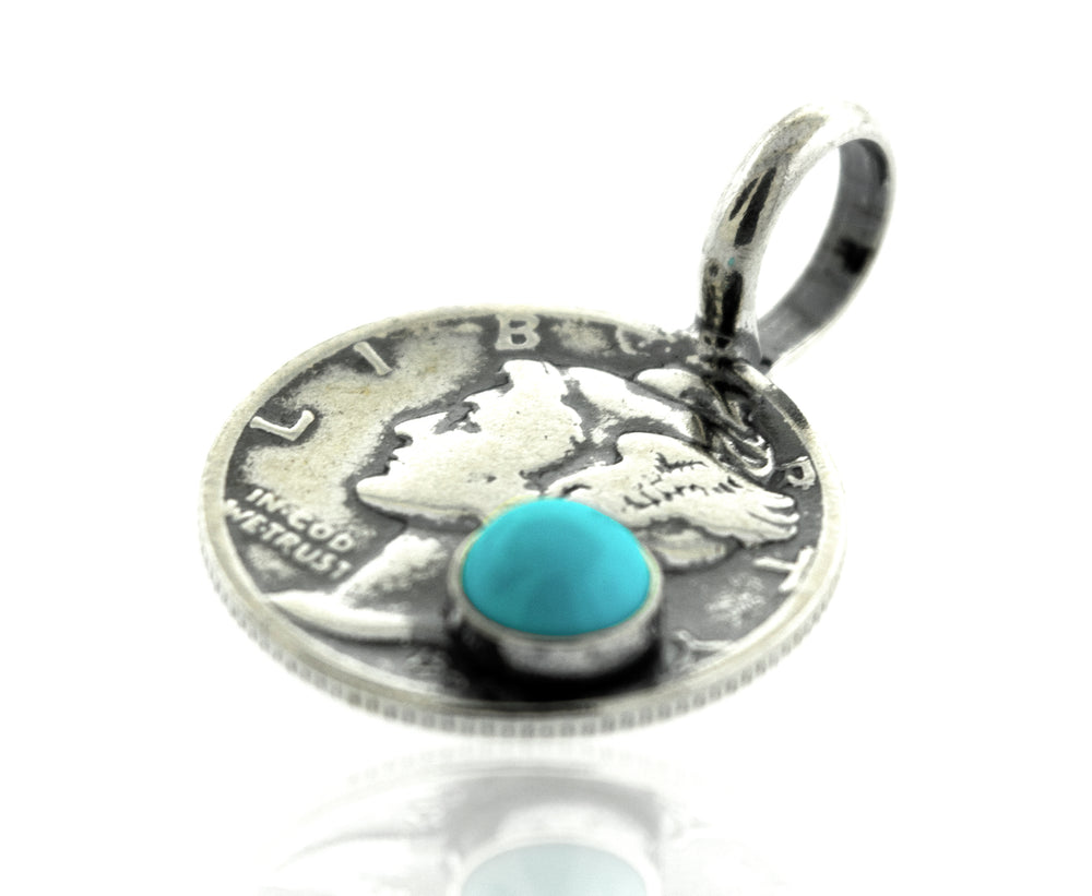 A Super Silver handmade Dime Pendant With A Round Turquoise stone.