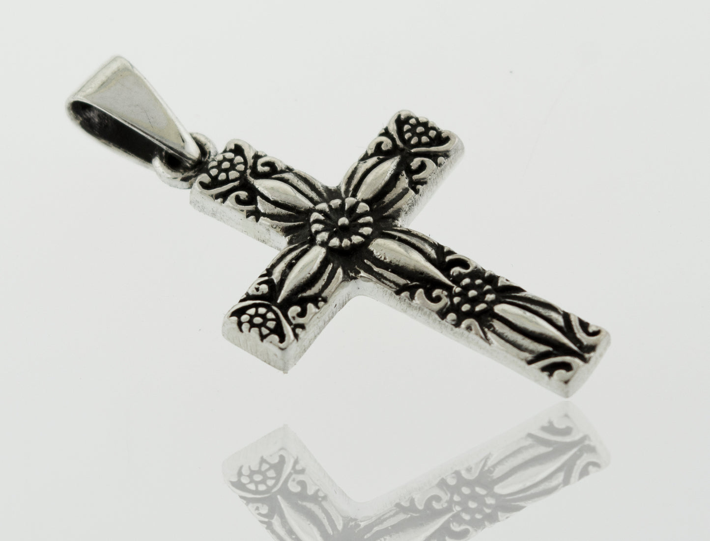 
                  
                    A Super Silver Cross Pendant With Flower Detail with an ornate design.
                  
                