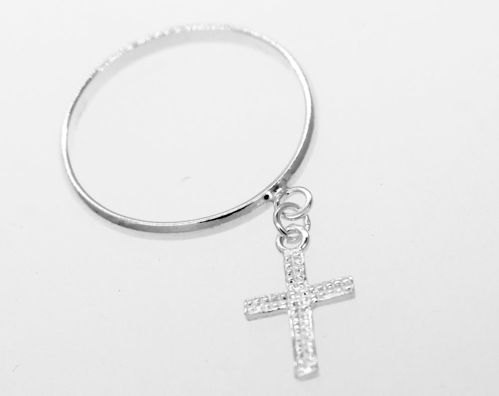 A simple Super Silver bangle with a Charm Ring with Cross charm.