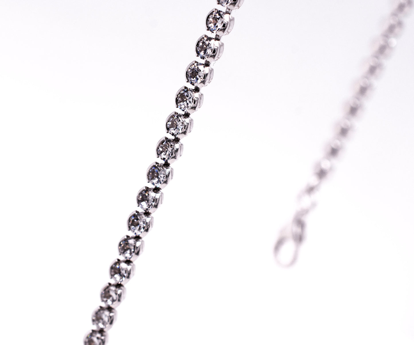 
                  
                    An elegant Super Silver silver chain with dainty diamonds for an adjustable length.
                  
                