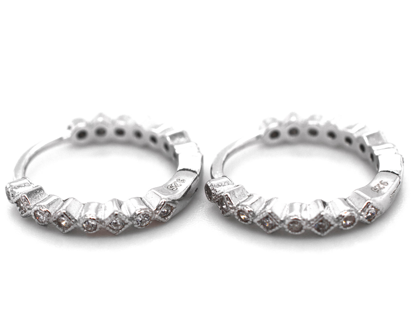 A pair of Fashionable Geometric CZ Hoops by Super Silver with diamonds.