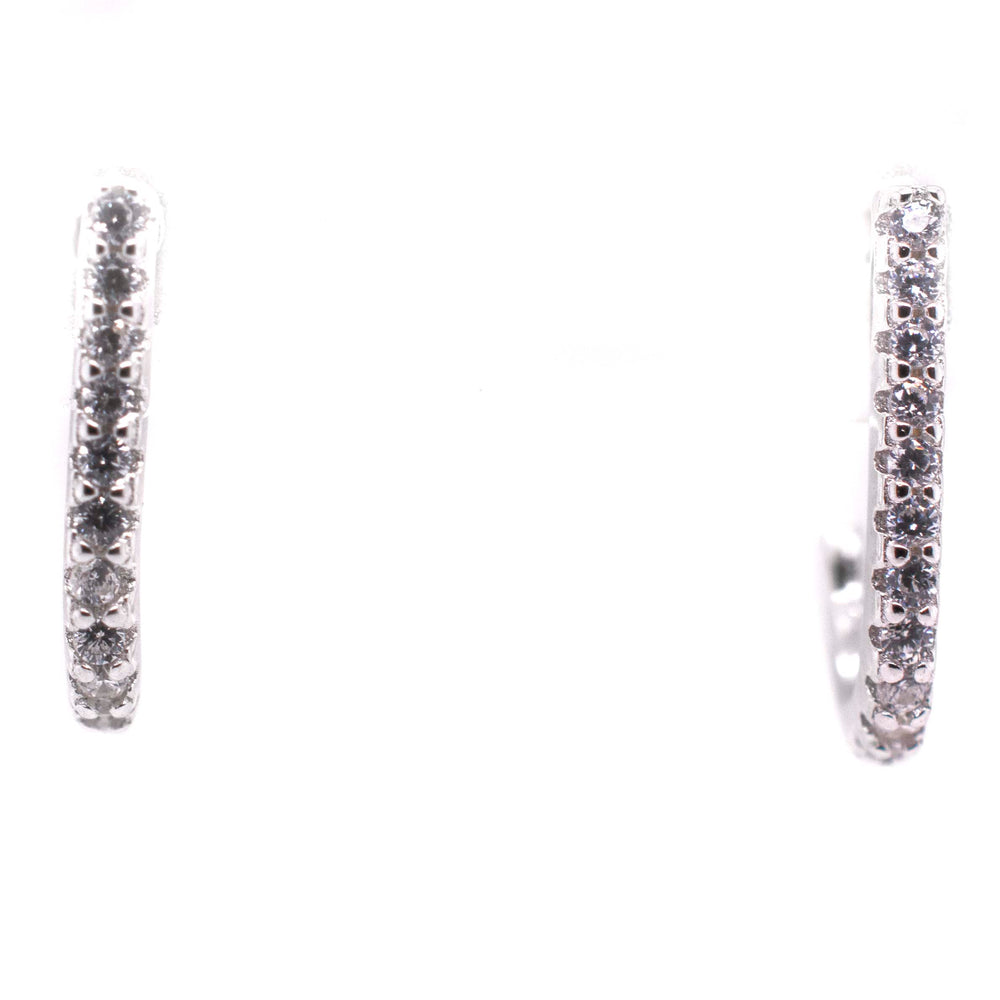 
                  
                    A pair of Super Silver Tiny Pave Cubic Zirconia Half Hoop Post Earrings.
                  
                