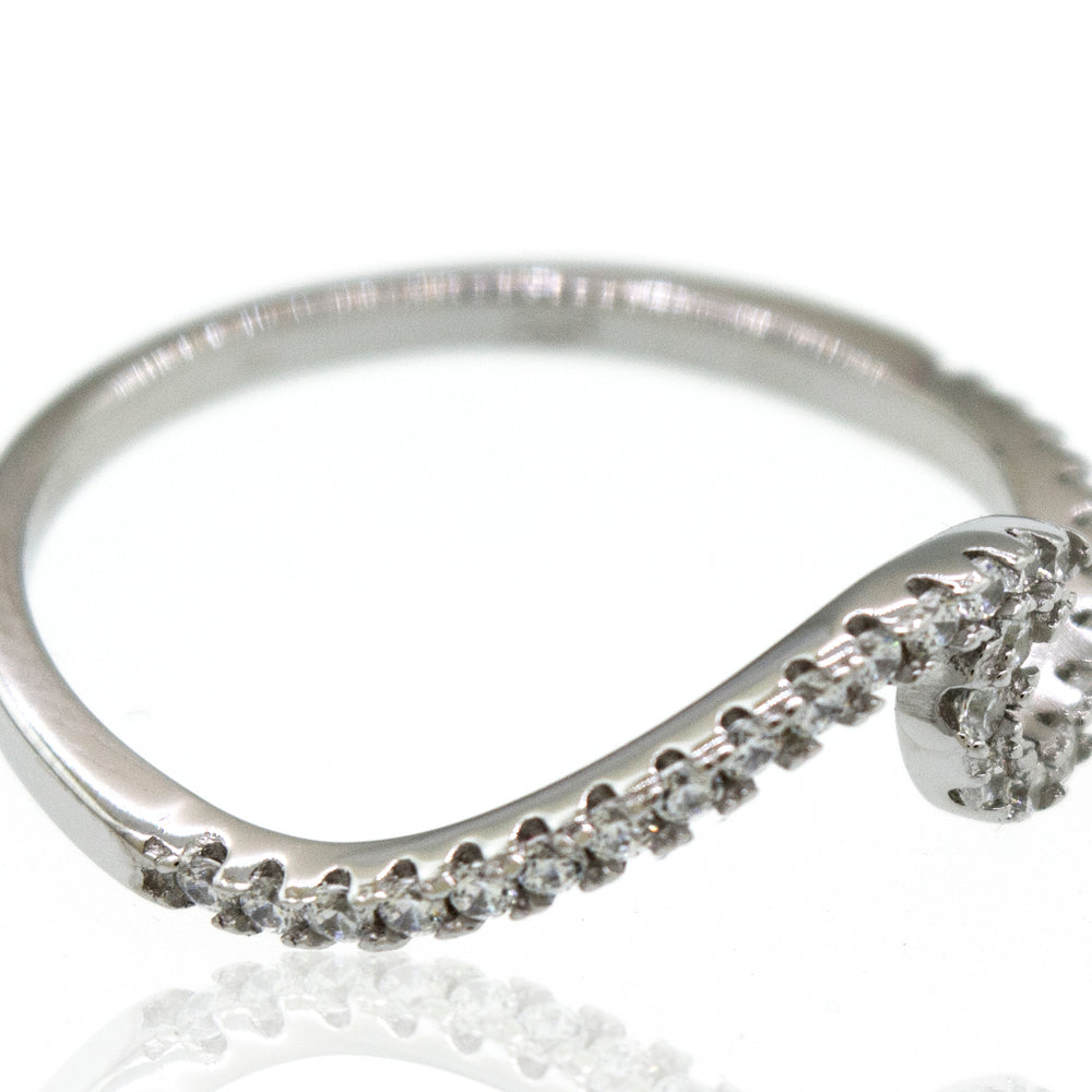 A Pave Wave ring with cubic zirconia diamonds on it.