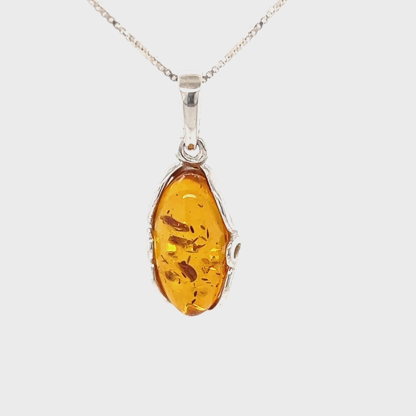 
                  
                    Load and play video in Gallery viewer, Charming Oval Amber Pendant
                  
                