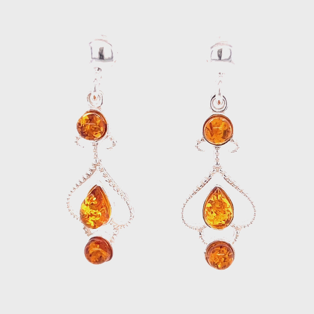 
                  
                    Load and play video in Gallery viewer, Exquisite Baltic Amber Scroll Earrings
                  
                