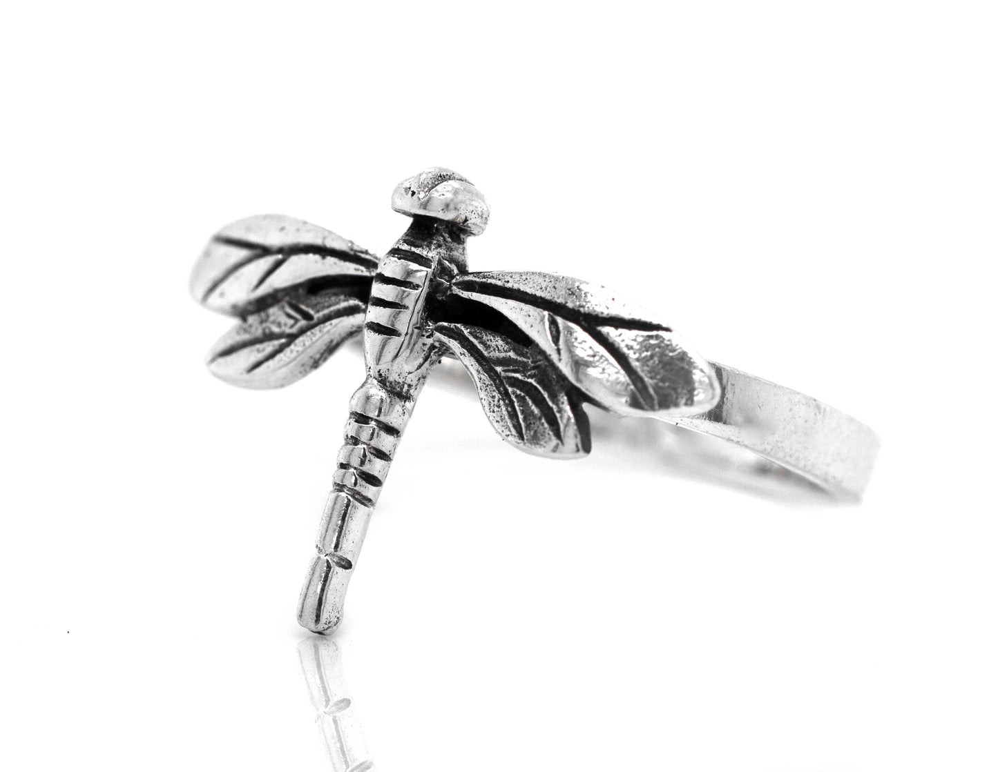 A Brilliant Silver Dragonfly Ring on a white background, adding a boho touch to any outfit.