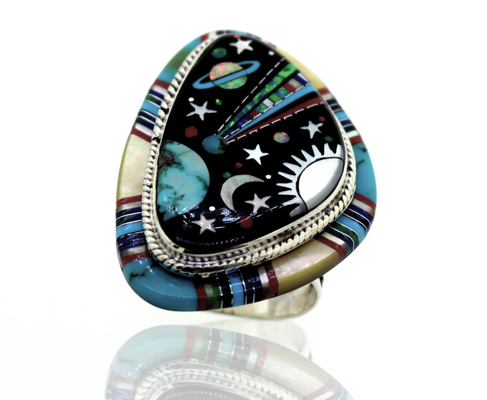 An Exquisite Handcrafted Outer Space Ring, featuring colorful stars and planets on a Super Silver band.