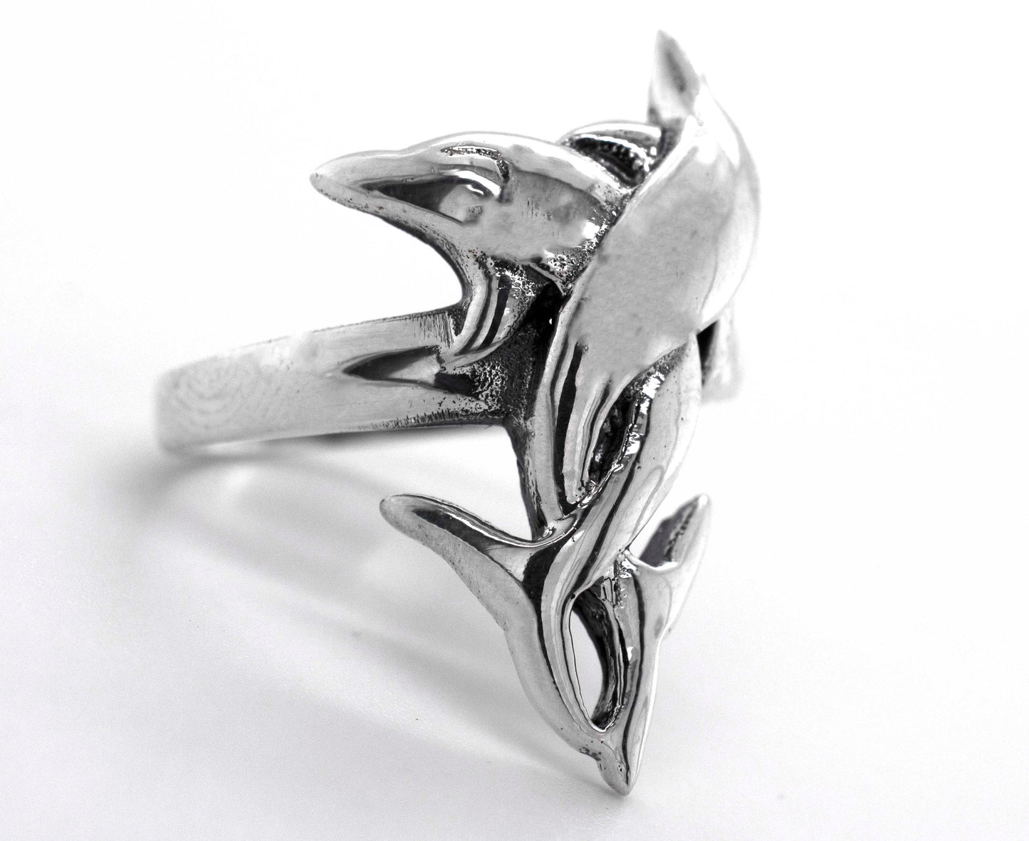 
                  
                    A sterling silver coiled dolphin ring.
                  
                