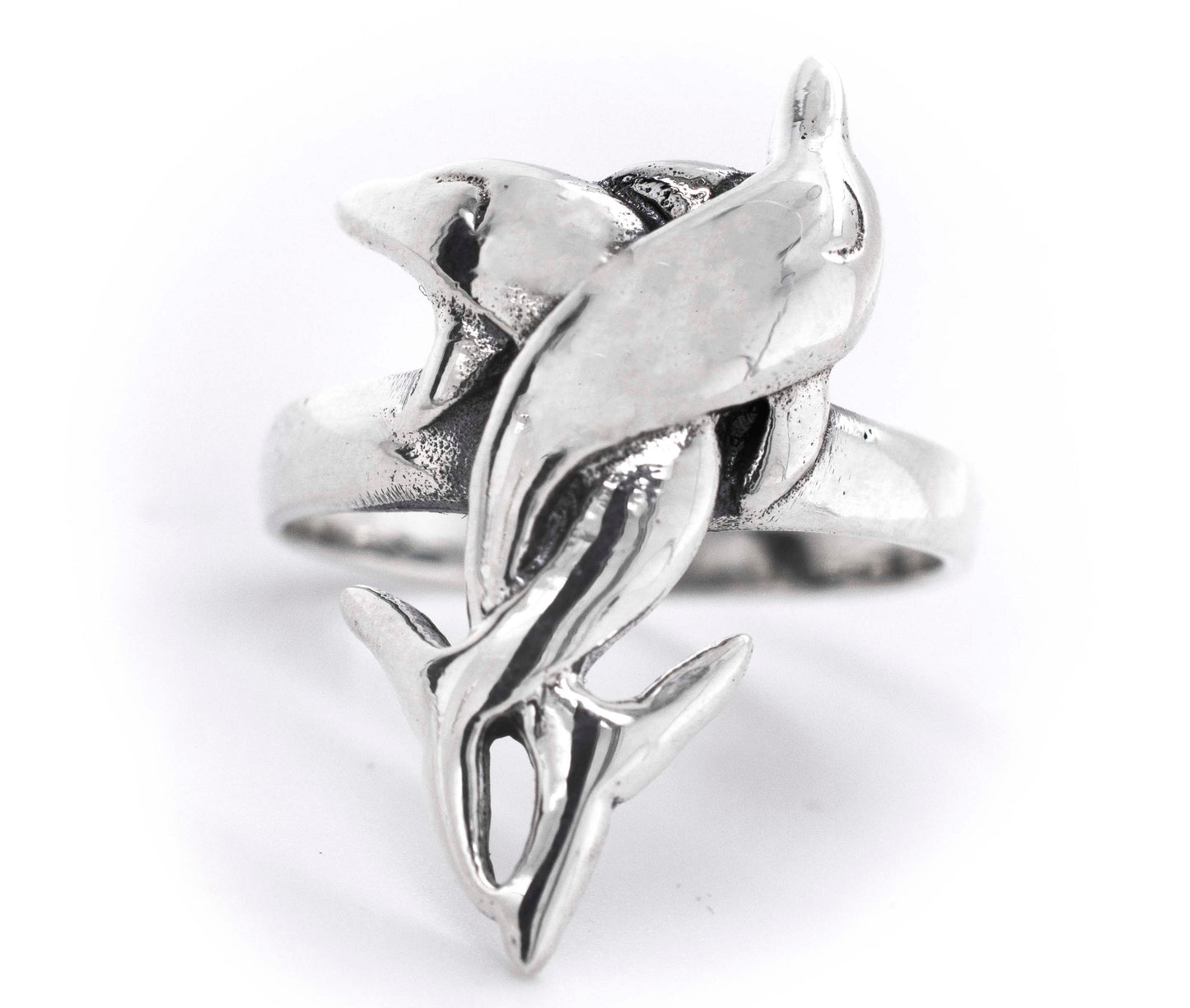 
                  
                    A Coiled Dolphin Ring featuring an intricately crafted dolphin, symbolizing the enchanting ocean.
                  
                