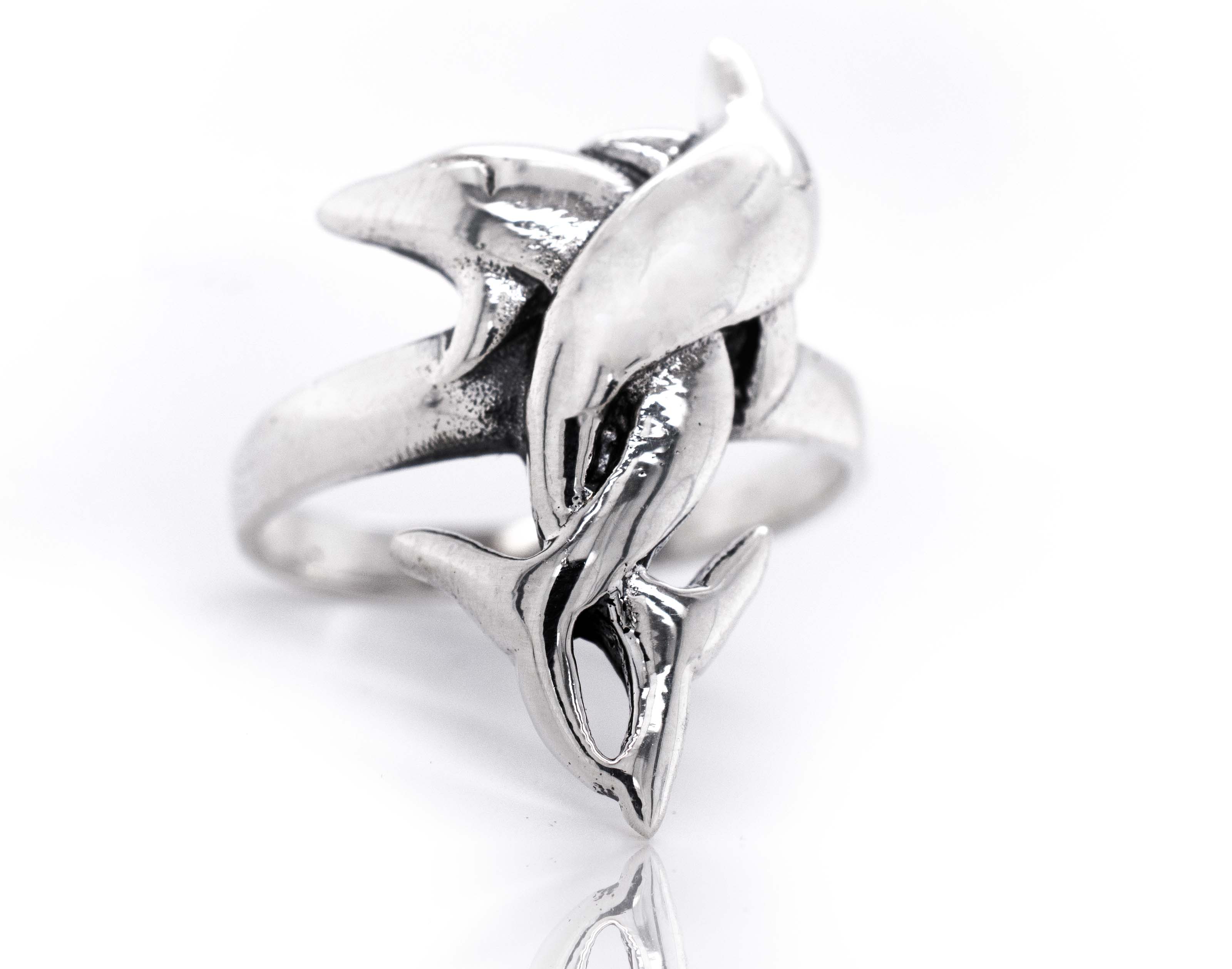 A Coiled Dolphin Ring.