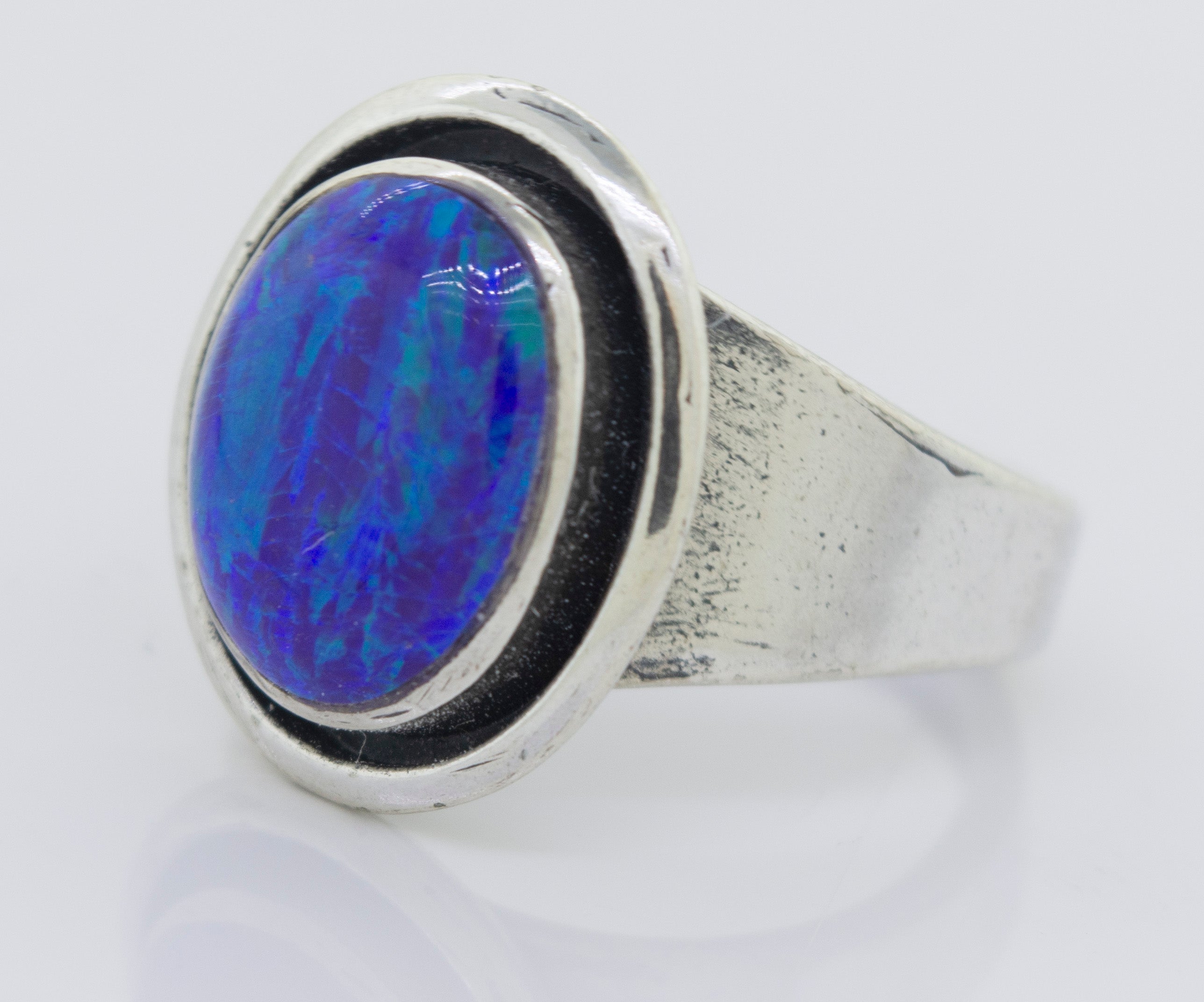 A minimalist silver ring with a Radiant Opal Signet Ring.