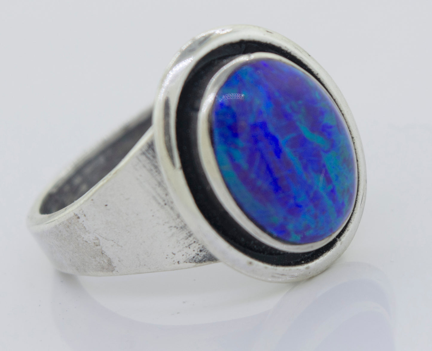 
                  
                    A minimalist silver Radiant Opal Signet Ring.
                  
                