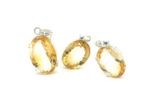 Three Brilliant Pronged Citrine Pendants on a white background, by Super Silver.