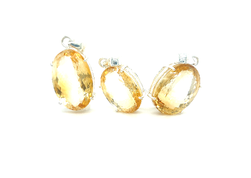 Three Brilliant Pronged Citrine Pendants by Super Silver on a white background.