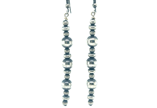 
                  
                    A pair of long handcrafted Navajo pearl earrings with an oxidized finish on a white background by Super Silver.
                  
                