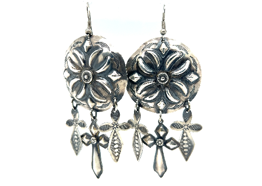 
                  
                    A pair of Super Silver handcrafted silver concho earrings with vintage-styled beauty and southwest charm.
                  
                