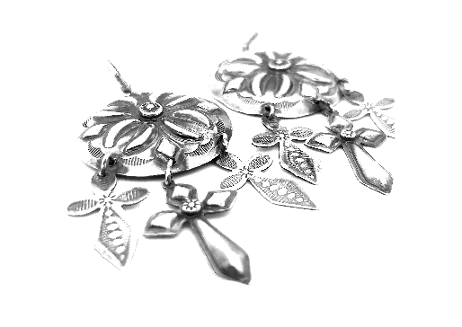 
                  
                    A pair of Super Silver Handcrafted Silver Concho Earrings adorned with delicate flowers and leaves, exuding southwest charm.
                  
                