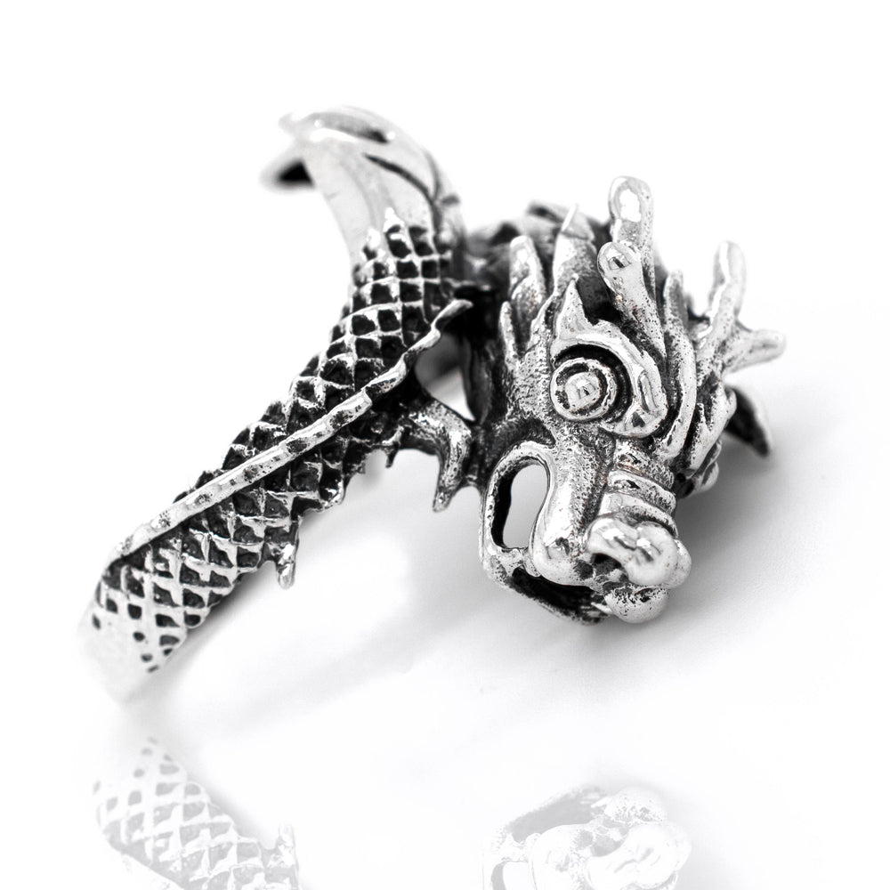 
                  
                    A Striking Silver Dragon Ring with a mythical dragon head design.
                  
                