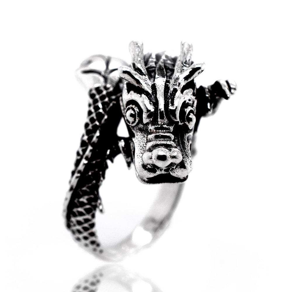
                  
                    A Striking Silver Dragon Ring with a mythical dragon head.
                  
                