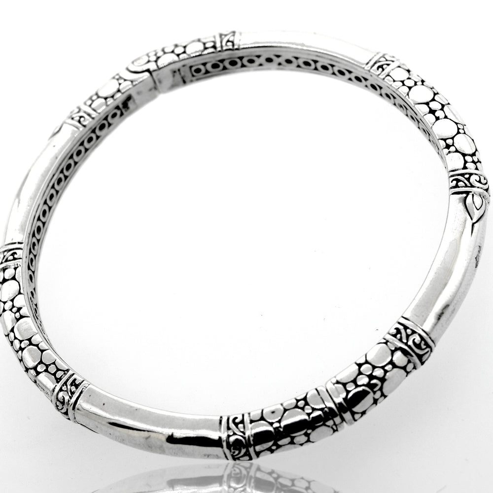A Super Silver Sterling Silver Handmade Designer Bangle with an intricate bubble design.