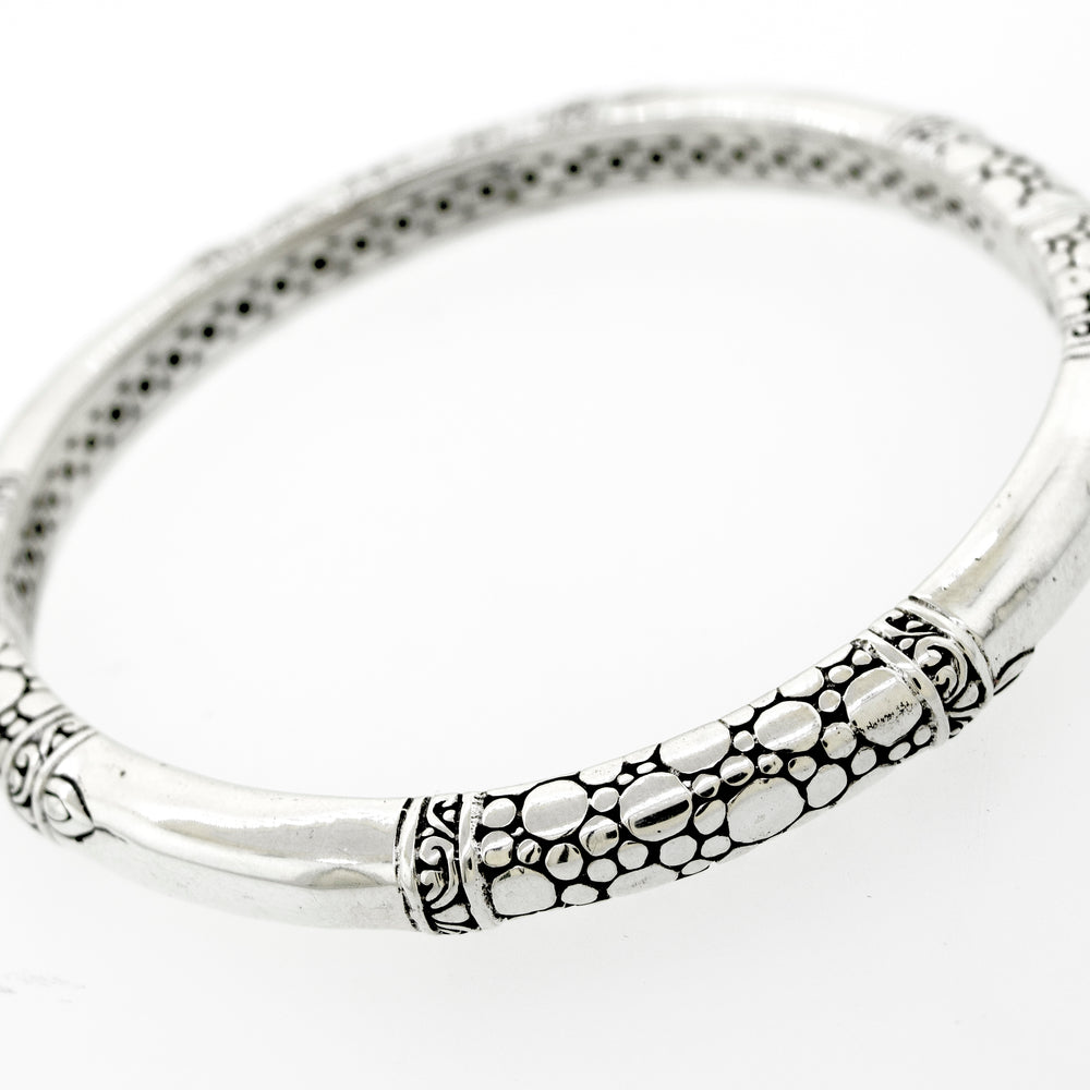 A Super Silver sterling silver handmade designer bangle with an ornate bubble design.