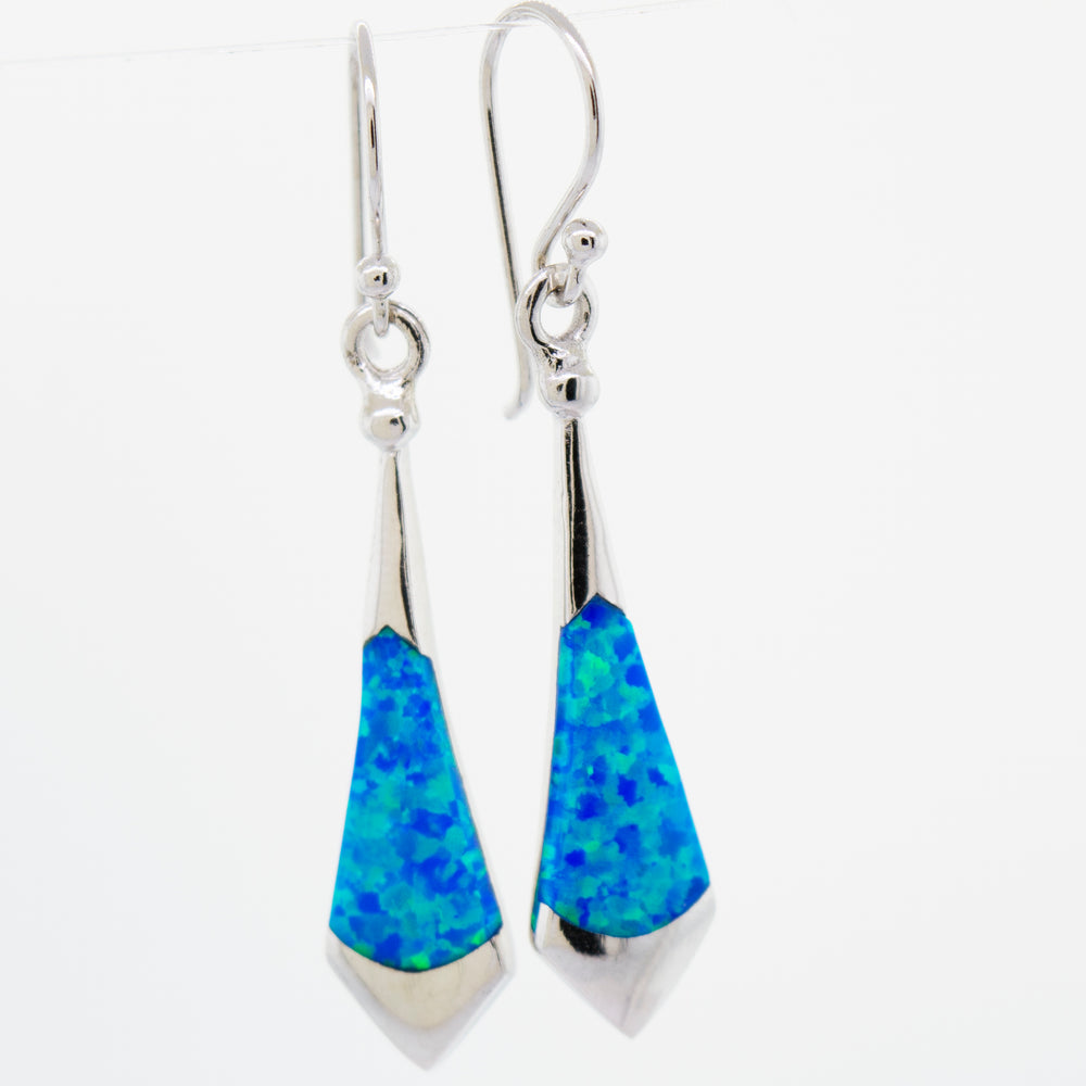 
                  
                    These Super Silver Blue Opal Earrings feature blue opal for a stunning look.
                  
                